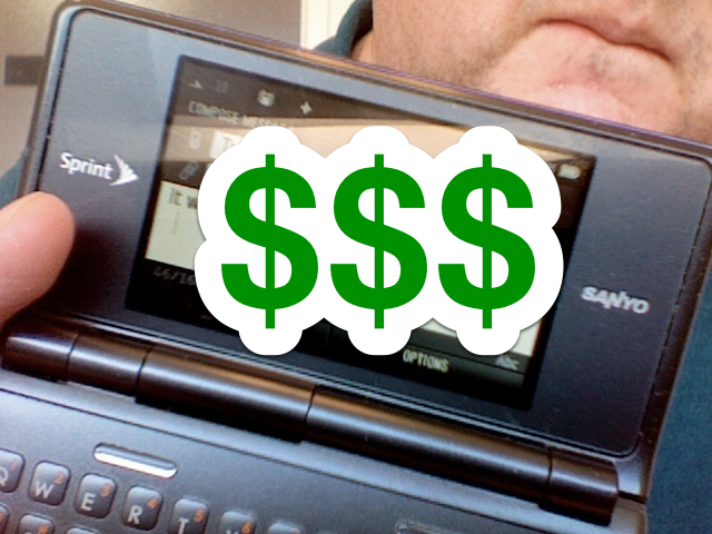 Dollar signs are superimposed over my Sanyo/Kyocera featurephone.