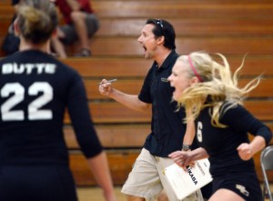 Butte College volleyball coach Dave Davis and players react to a point during a recent scrimmage against Chico State at Acker Gym. 