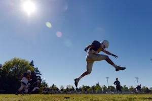 Pleasant Valley High's Chad Olsen kicks off during a recent practice for the Vikings.