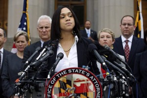 Marilyn Mosby, Baltimore state's attorney, pauses while speaking during a media availability, Friday, May 1, 2015 in Baltimore. Mosby announced criminal charges against all six officers suspended after Freddie Gray suffered a fatal spinal injury while in police custody. (AP Photo/Alex Brandon)