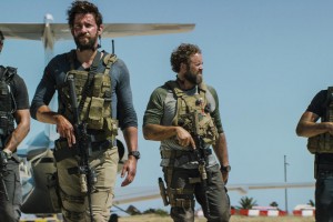 In this photo provided by Paramount Pictures shows Pablo Schreiber, from left, as Kris "Tanto" Paronto, John Krasinski as Jack Silva, David Denman as Dave "Boon" Benton and Dominic Fumusa as John "Tig" Tiegen, in the film, "13 Hours: The Secret Soldiers of Benghazi" from Paramount Pictures and 3 Arts Entertainment/Bay Films. The movie releases in U.S. theaters Jan. 15, 2016. (Christian Black/Paramount Pictures via AP)