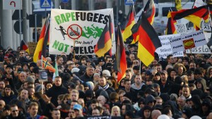 Supporters of anti-immigration right-wing movement PEGIDA (Patriotic Europeans Against the Islamisation of the West) take part in in demonstration rally, in reaction to mass assaults on women on New Year's Eve, in Cologne, Germany, January 9, 2016.  Wolfgang Rattay / Reuters
