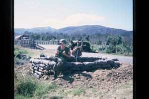 Phil eating C rations with mortar