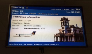 Departure screen at SFO for United 5303 - note Bidwell Mansion.